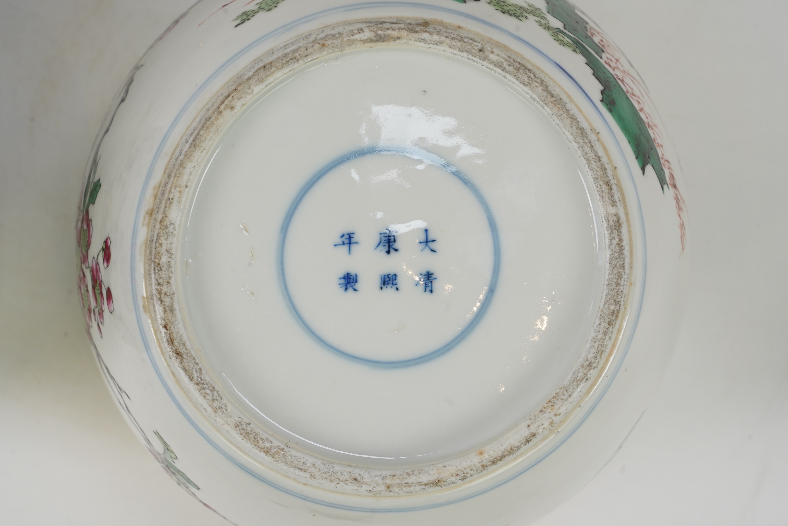 A pair of Chinese famille rose jars and covers, Kangxi mark but late 19th/early 20th century